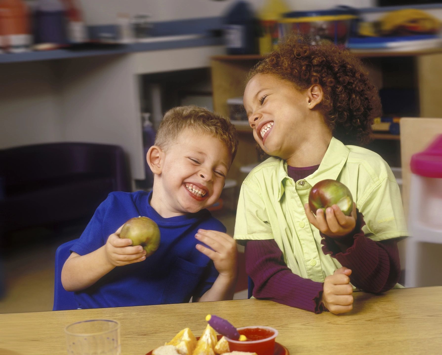Teacher engaging with young children in a classroom