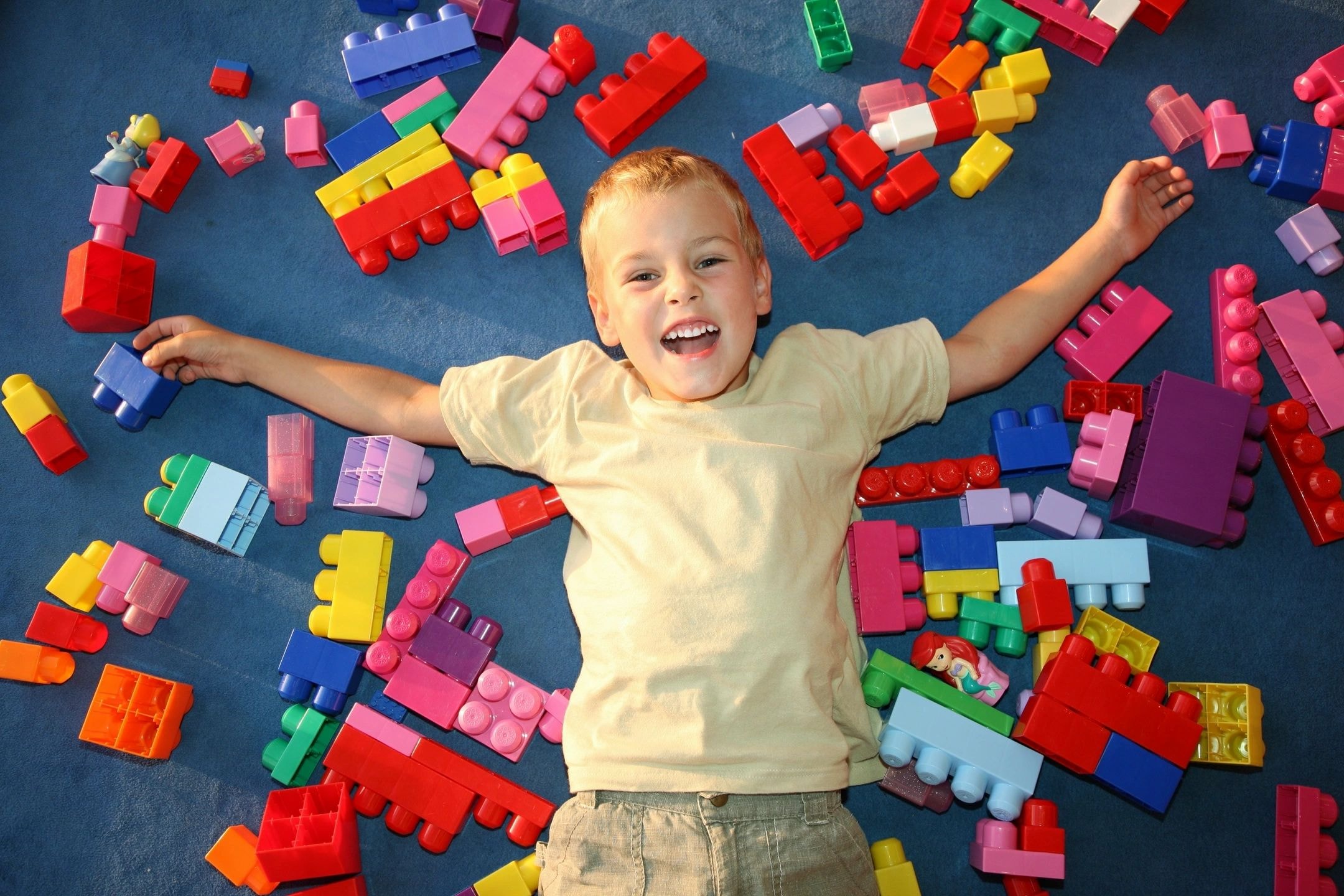 Child playing with colorful building blocks